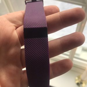 Purple Fitbit with charger